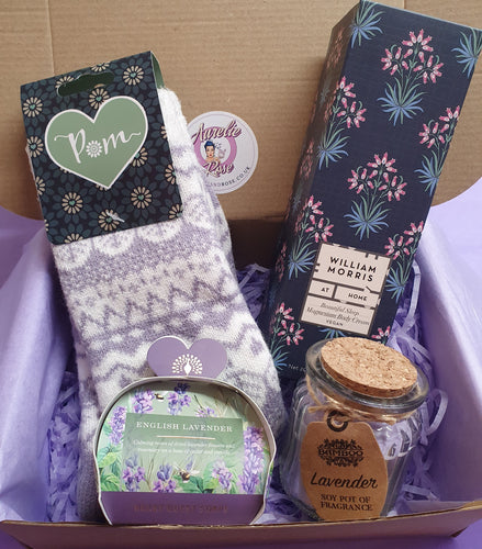 Gift set with socks, soap, and other items in a box
